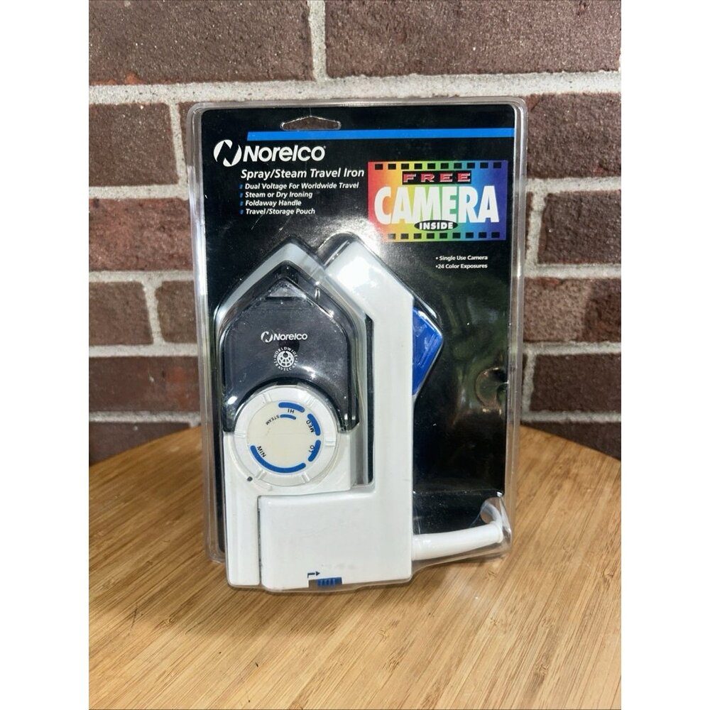 Vintage Norelco Travel Iron Dual voltage steam or dry W/ free Single Use camera